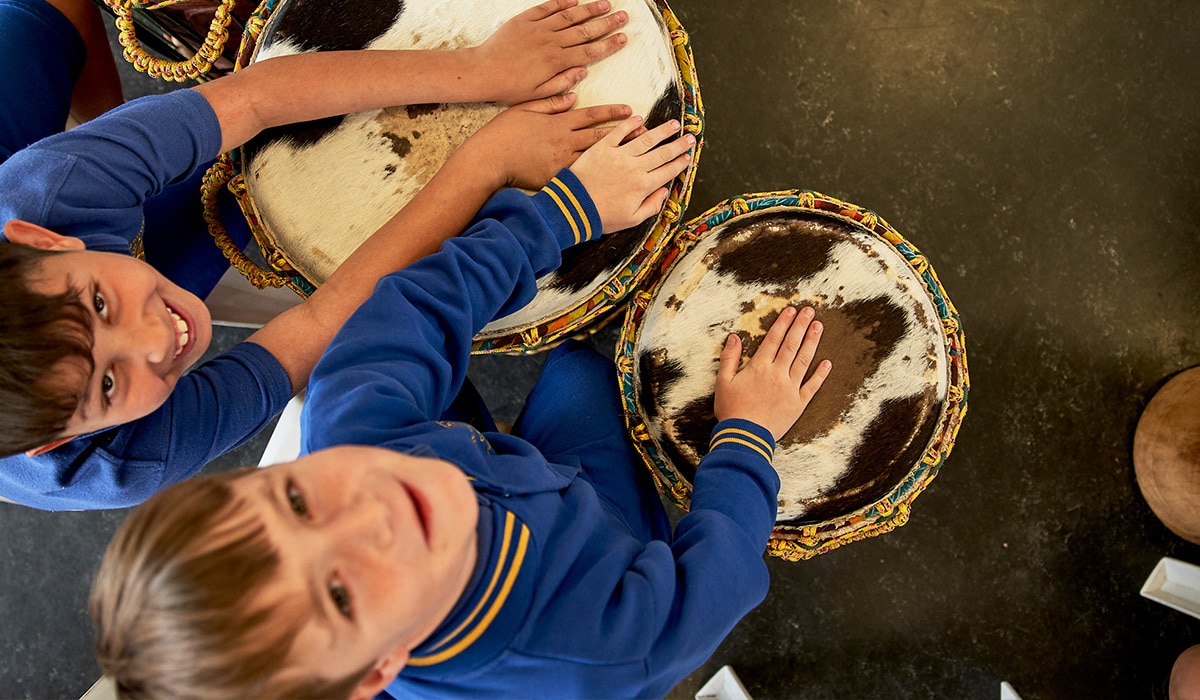 Kids playing bongo drums