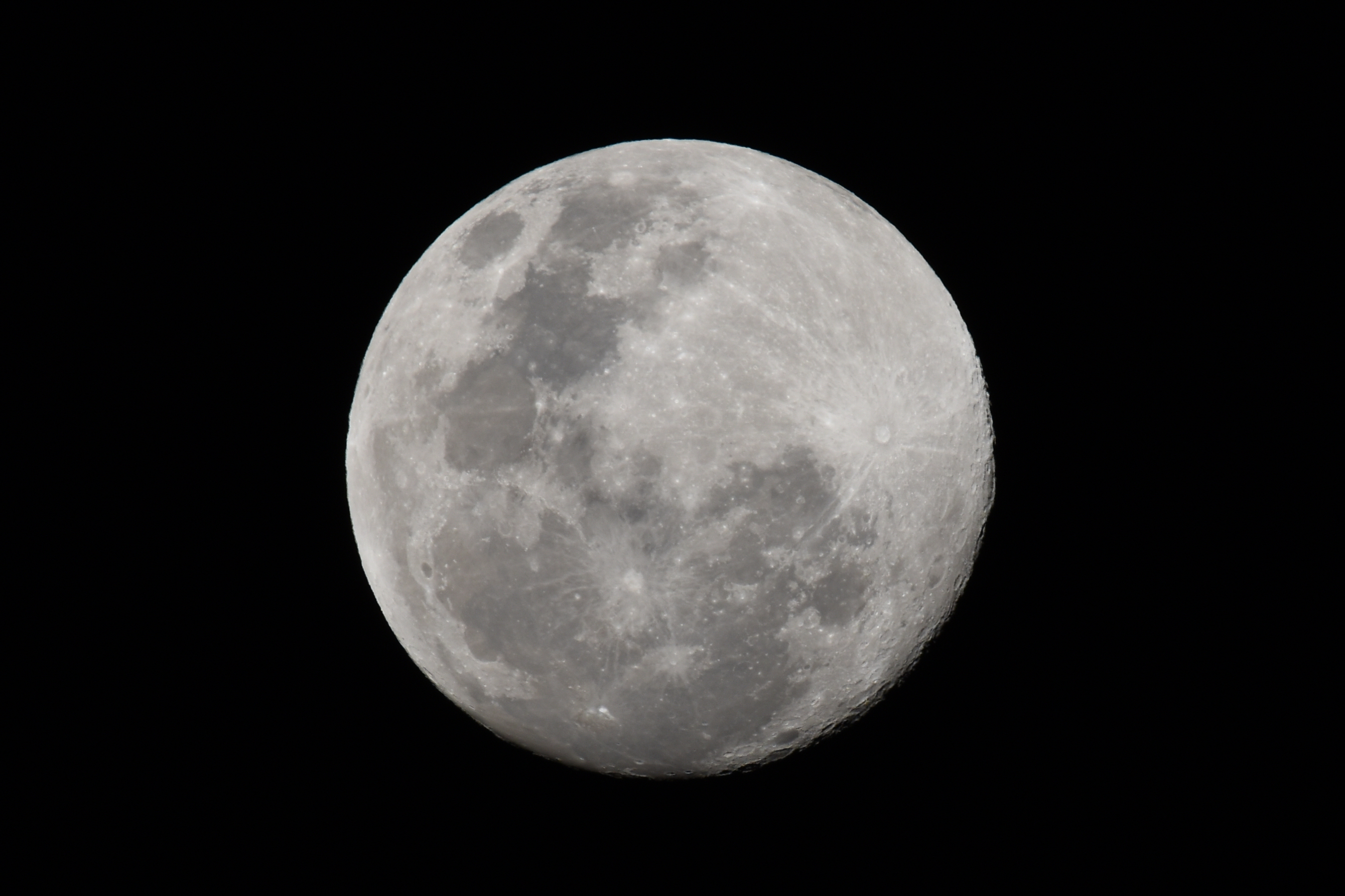 A clear photo of the moon on a black background